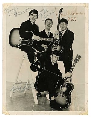 Signed photograph by the Beatles.