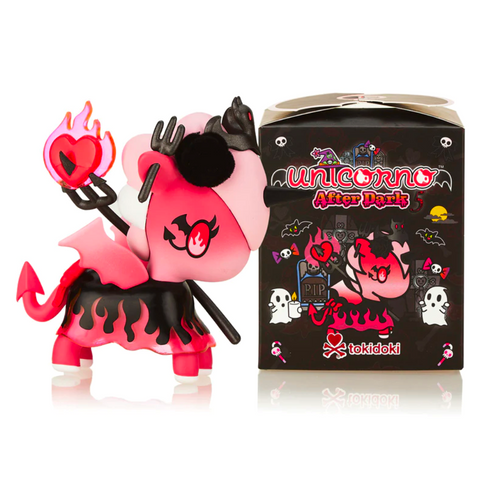 A pink and black unicorn figurine with devil horns and a pitchfork stands next to a box labeled "Tokidoki Unicorno After Dark Series 5 Blind Box" from tokidoki (IT), adding an extra touch of spookiness reminiscent of the collection.