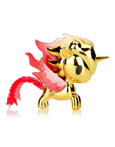 The Tokidoki Lucky Unicorno Fuego Limited Edition figurine, featuring a glossy golden finish with red horns, wings, and tail, stands on a white background, capturing the enchanting spirit of fortune.