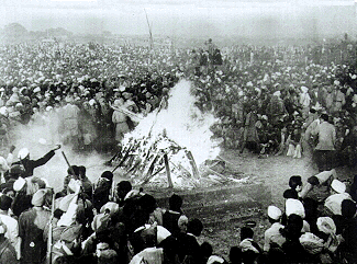 Cremation of Mahatma Gandhi at Rajghat, 31 January 1948. It was attended by Jawaharlal Nehru, Lord and Lady Mountbatten, Maulana Azad, Rajkumari Amrit Kaur, Sarojini Naidu and other national leaders. His son Devdas Gandhi lit the pyre.[113]