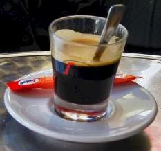 Espresso appears dark brown with a gold-colored foam on top, and is often served in small portions.