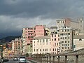 Sarzano hill photographed from the causeway. Between the street and the base of the buildings one can glimpse what remains of the Grazie and Marina walls. In the upper right corner, part of the complex of the former monastery of San Silvestro (visibly restored) and home of the Faculty of Architecture can be seen.