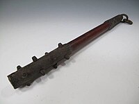 A small antique Japanese wooden club with iron-covered ends and iron studs (ararebō)[3]