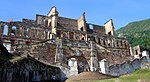 Ruins of a large stone building and flight of steps.