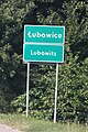 Bilingual entry sign in Polish and German in Łubowice, Poland