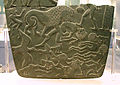 Image 7Possible prisoners and wounded men of the Buto-Maadi culture devoured by animals, while one is led by a man in long dress, probably an Egyptian official (fragment, top right corner). Battlefield Palette. (from Prehistoric Egypt)