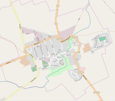 Mapa konturowa Reszla, blisko centrum na dole znajduje się ikonka zamku z wieżą z opisem „Zamek w Reszlu”