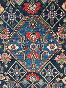 Section (central medallion) of a South Persian rug, probably Qashqai, late 19th century, showing irregular blue colours (abrash)