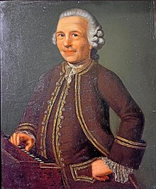 Friederici standing next to a keyboard instrument