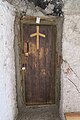 A grapevine cross inlay on a door in Vardzia cave monastery, Georgia