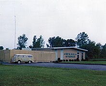 The combined WKAL studio and transmitter facility, South Jay Street, Rome, NY; Spring of 1974. During the previous year, FM Stereo service had been initiated, simulcasting AM programming. The station's building markings were updated to advertise the change. To the left the station's VW Bus can be seen which was utilized during this period for promotional events.