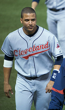 A man in a gray baseball uniform