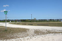 Last remaining section of Ali Baba Circle at intersection with Aladdin Boulevard, showing upper northwest quadrant of what was to be Ali Baba Park.