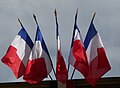 Multiple French flags as commonly flown from public buildings