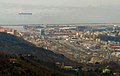 The mouth of the Polcevera; in the background is the Port of Genoa