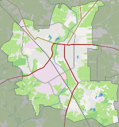 Mapa konturowa Ciechanowa, blisko centrum u góry znajduje się ikonka zamku z wieżą z opisem „Zamek w Ciechanowie”