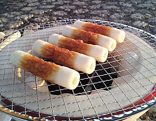 Chikuwa made of surimi, on a shichirin grill