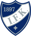 Helsingin IFK:n vaakuna. Käytössä ensisijaisena logona 1928–1993 sekä 2008 alkaen.