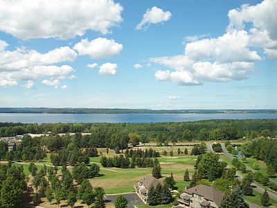 The East Arm of Grand Traverse Bay from the east, with the Old Mission Peninsula in the background. Hills of the Leelanau Peninsula are faintly visible on the horizon.