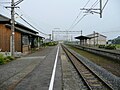 A view of the platforms and tracks. Note what appears to be the trackbed of a former track next to the platform to the left.