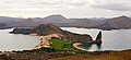 Image 38Pinnacle Rock on Bartolomé Island, with Santiago in the background and a ferry on the right for scale (from Galápagos Islands)