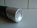 Picture of the bottom of an aerosol spray can.