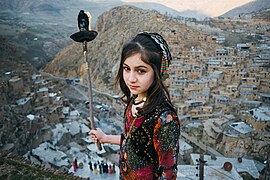 Village girl in Palangan prepares to kindle fire for Newroz, 2019