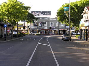 Papanui Junction with the 99-year-old Papanui Building centred. Taken from Papanui Road with the Main North Road leading away to the right and Harewood Road leading away to the left. (2008)