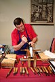 Image 10A traditional bookbinder at work (from Bookbinding)