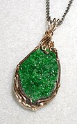 Pendant in uvarovite, a rare bright-green garnet. The long dimension is 2 cm (0.8 inch)