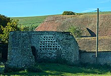 The ruins of a square Dovecote at Alciston, East Sussex, England. September 2024.