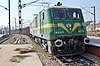 Indian Railways WAG-9 class electric locomotive no 31179 pauses at Agra Fort railway station, at the head of a heavily laden eastbound ore train in 2008