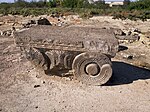 Ancient stone capital with fern-like relief at the archaeological site of Dvin