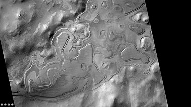 Layers just outside rim of western side of South crater in the form of "Swiss cheese", as seen by CTX camera (on Mars Reconnaissance Orbiter). Note: this is an enlargement of a previous image of west side of South crater.