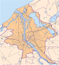 Mapa konturowa Rygi, w centrum znajduje się punkt z opisem „Koci Dom”