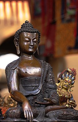 Photo of bronze statue of Buddha at the Sikkim Pavilion