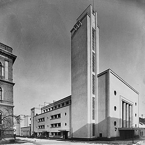 Ateneul Universității Regele Ferdinand, azi Colegiul Academic (1935), de George Cristinel, Art Deco târziu cu mici influențe clasiciste[9]