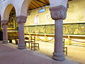 Upper Romanesque chapel with capitals and tapestry