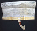 An English deed written on fine parchment or vellum with seal tag dated 1638.