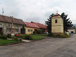 Centre of Chomýž with belfry and cross