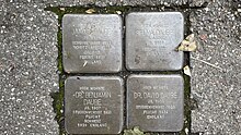 four square brass plaques engraved with names and dates