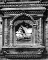 Chittadhar sitting at a traditional window.