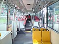 Image 70Interior of a wheelchair-accessible transit bus, with bucket seats and smart-card readers at the exit. (from Transit bus)