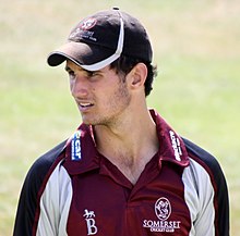 Lewis Gregory on a cricket field.