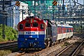 Mugunghwa train pulled by a diesel locomotive.