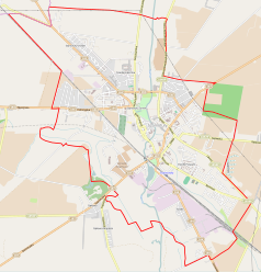 Mapa konturowa Szamotuł, blisko centrum u góry znajduje się ikonka zamku z wieżą z opisem „Zamek w Szamotułach”