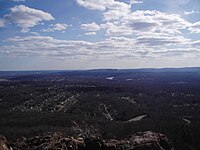 View looking south from the top of West Peak in Meriden, Connecticut. Sleeping Giant State Park can be seen.