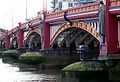 Image 1Vauxhall Bridge across the River Thames opened in 1906 and features sculptures by F. W. Pomeroy.