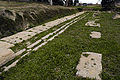 The series of slotted bases in the building north of the stoa