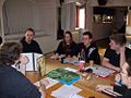 Image 21A group playing a tabletop RPG. The GM is at left using a cardboard screen to hide dice rolls from the players. (from Role-playing game)